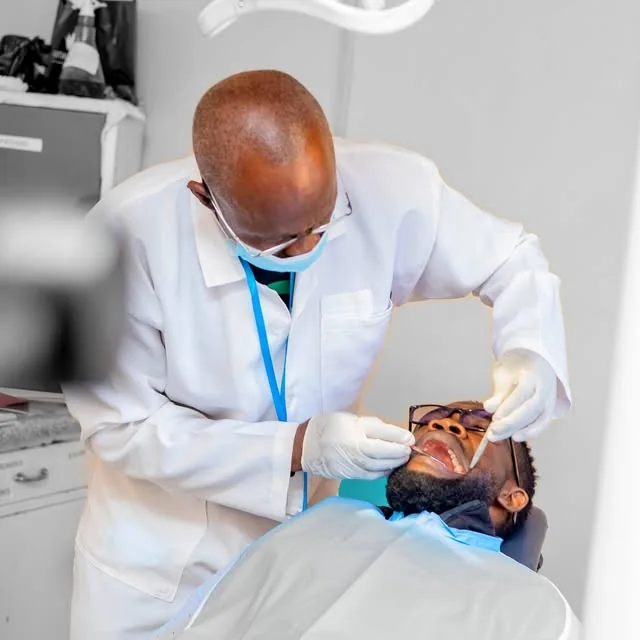 Dental clinician providing treatment at New Life Medical Centre